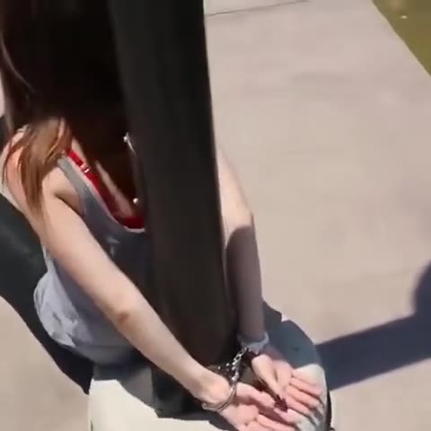 Girl Handcuffed To Lamp Post On River Bank