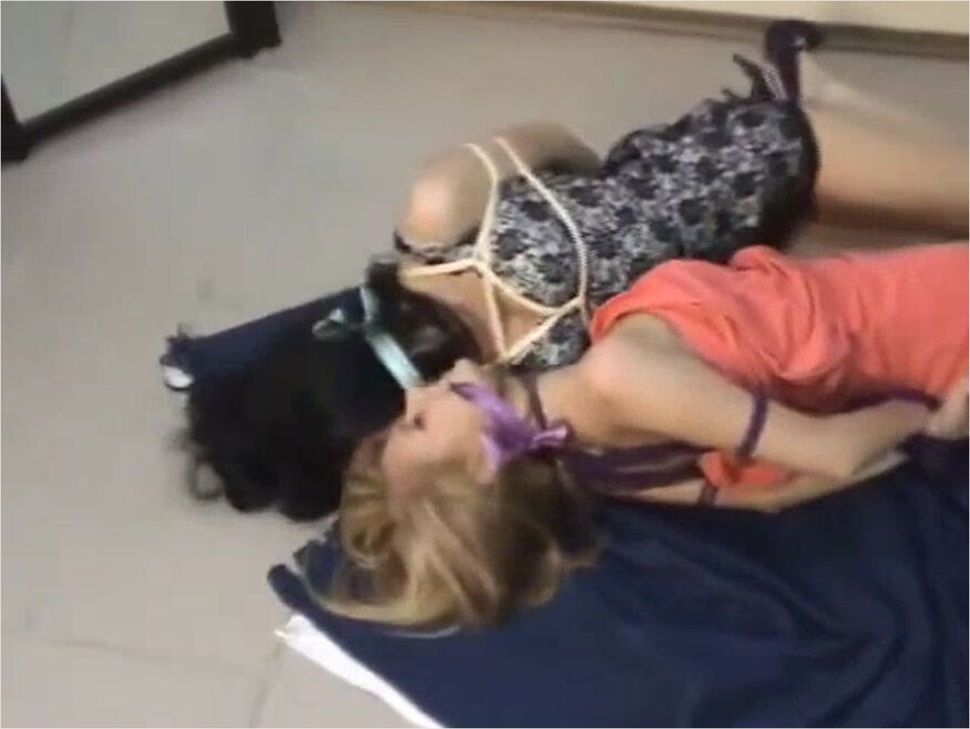 Duo Hogtied On Carpet