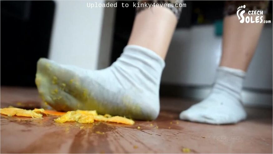 Wild Brunette In Socks Crashes An Orange With Her Feet