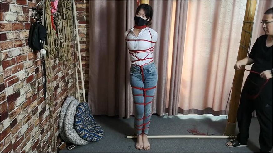 Asian Girl Post Tied With Red Rope
