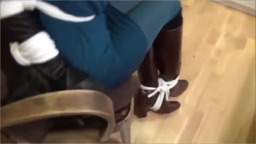 Girl In Boots And Gloves Chair Bound And Panel Gagged