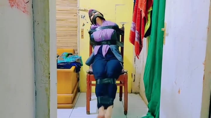 Hijab Indo Taped To A Chair