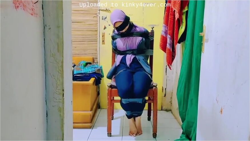 Hijab Indo Taped To A Chair