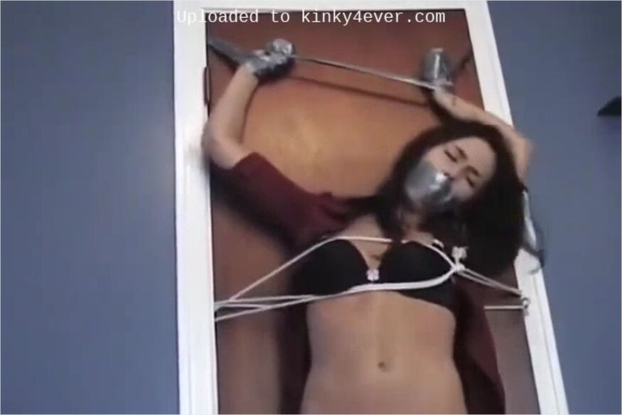 Brunette Tied To The Door And Tape-gagged