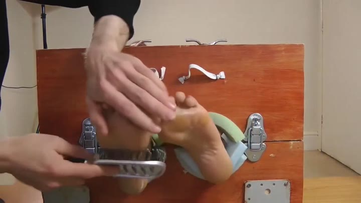 Angelina Tickled Barefoot In Stocks
