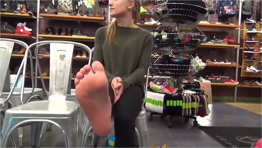 Amateur Hottie Trying On A New Pair Of Socks On Her Beautiful Feet