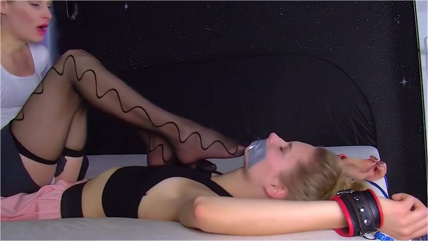 Two Girls Sniffing Each Other Nylon Feet While Tape