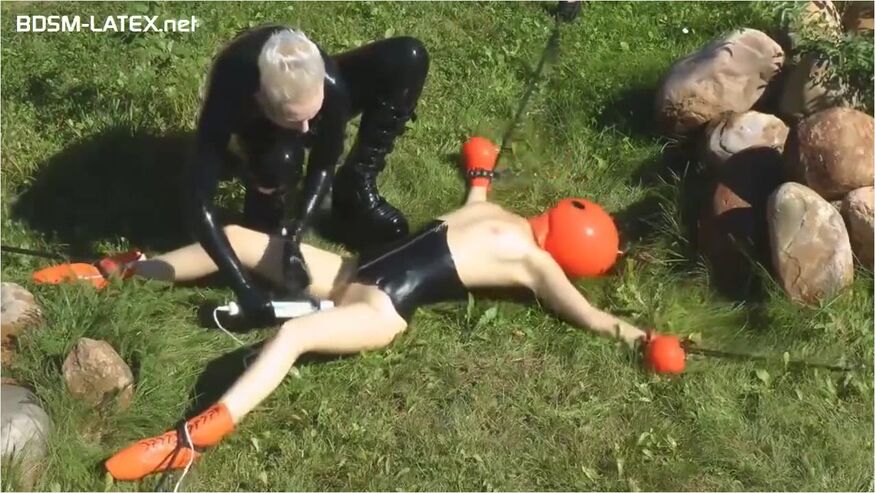 Spread Eagle In Latex Outdoors