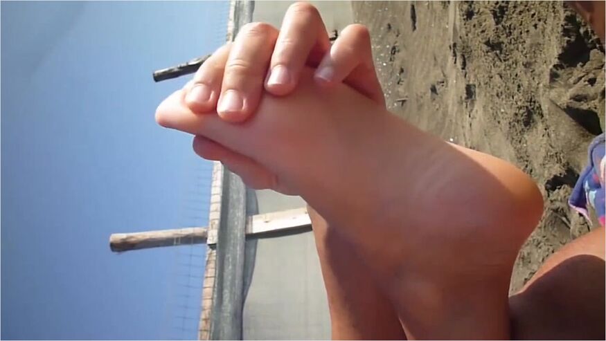 Lovely Amateur Girl Massages Her Amazing Naked Feet And Soles On The Beach