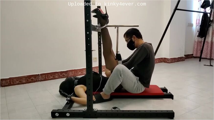 Chinese Girl In Leather Hood And Metal Bondage