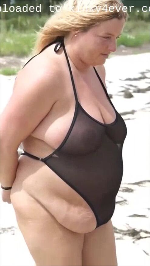 Handcuffed In Sheer Swimsuit On The Beach