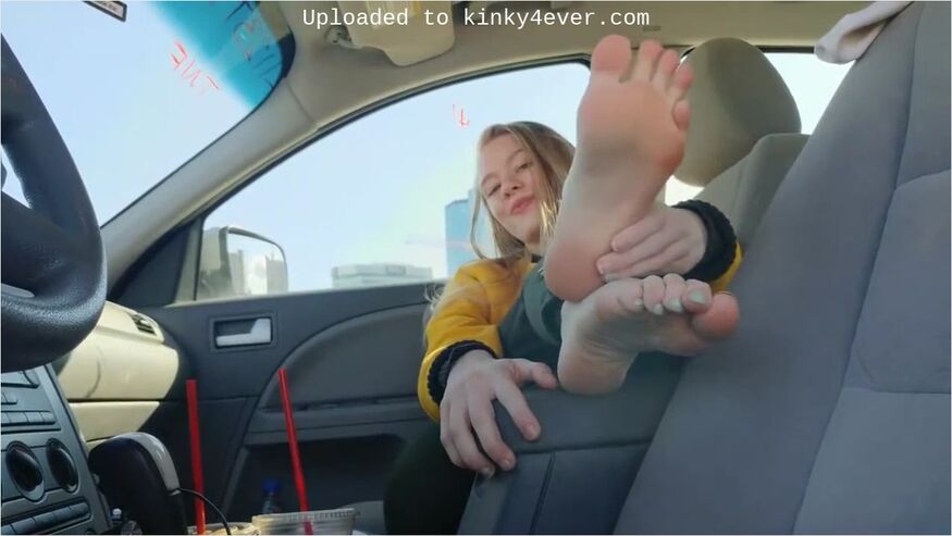 Charming teen 18+ Goes Barefoot In The Car And Touches Her Cute Feet